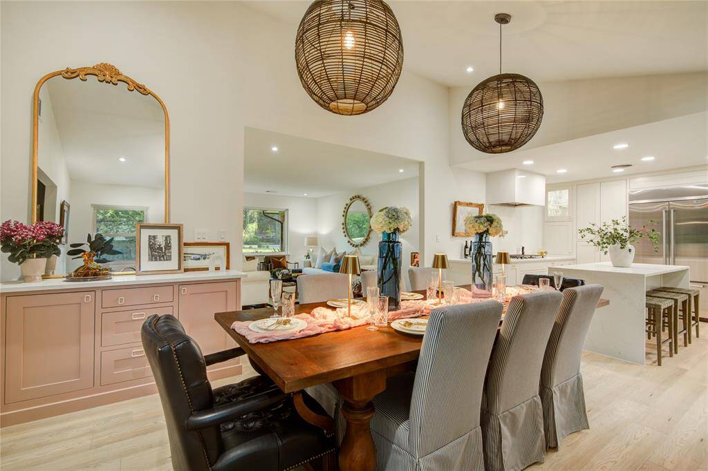 Central to the kitchen, living room and den, your guests will gather in the dining room to share meals, games, and stories filling the vaulted ceiling with laughter.