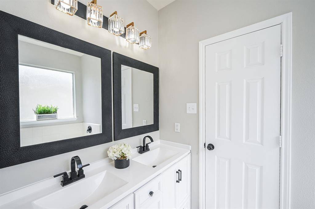 Enjoy the convenience of dual vanities and an expansive walk-in closet.