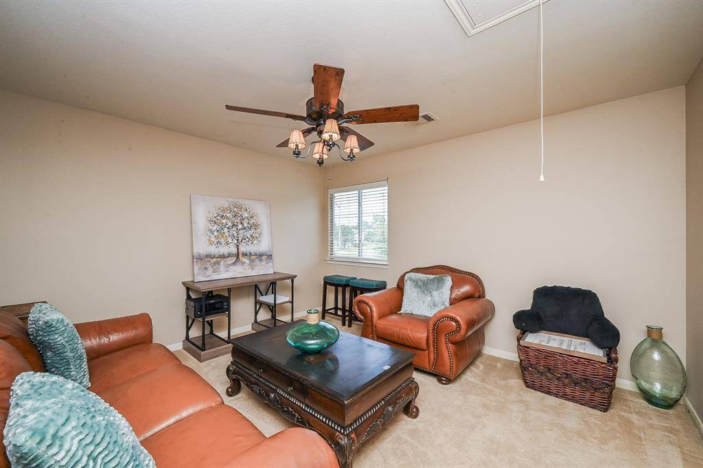 This versatile flex space is ideal for a home office, game room, or media lounge.