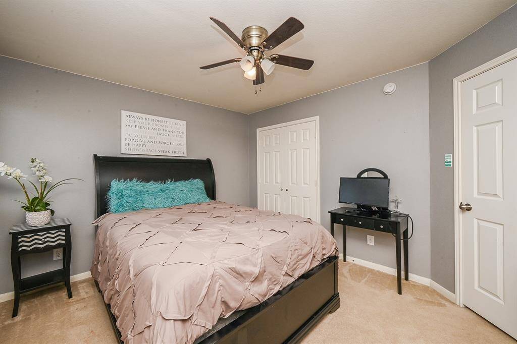 Your secondary bedroom upstairs offers a cozy personal retreat. It's a perfect space for family members or guests to relax and unwind in comfort and privacy.
