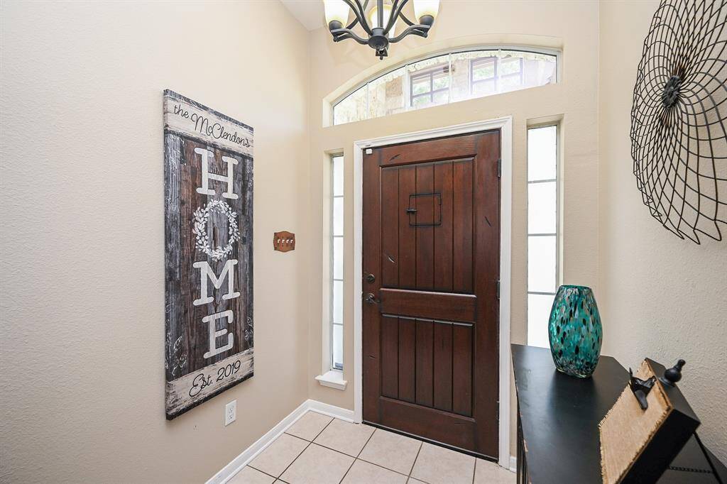 From the moment you step through the front door, you're welcomed by an airy, light-filled entryway where the windows let in a flood of natural light, creating a bright and uplifting first impression.