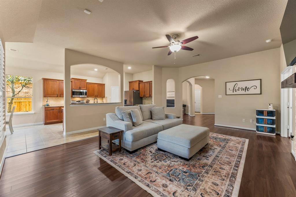 View of the family/living room to the kitchen and entry way.