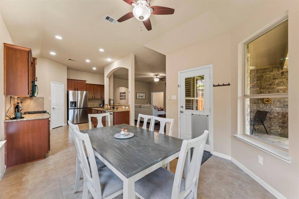 View of the kitchen and family room from the breakfast area.