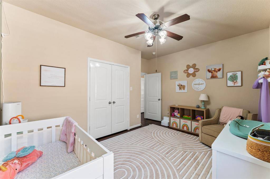 View of one of the secondary bedrooms at the front of the home.