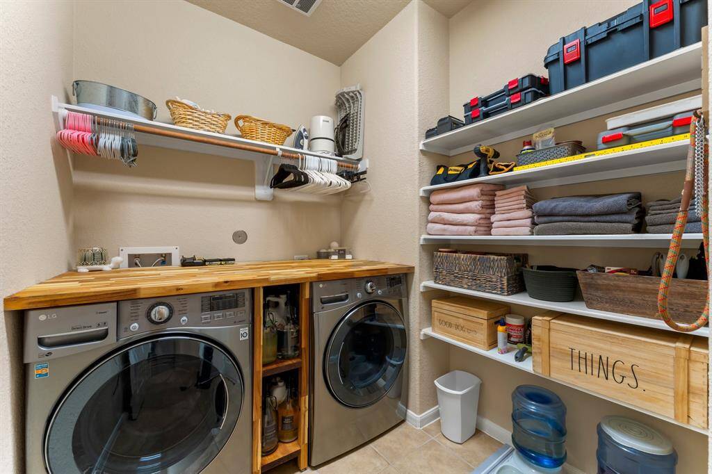 Utility Room includes built-in countertop.  Washer and Dryer conveys to the buyer (if desired).
