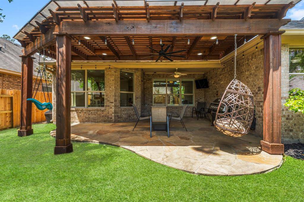 Pergola covered with clear roofing to keep you cooler in our Texas heat!  Recessed lighting and a new ceiling fan added.