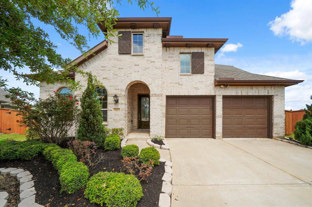 Command Attention from the Curb.Let your eyes land on striking architecture and rich textures—where crisp stone elevation meets bold garage doors, framed by lush, manicured landscaping. Imagine arriving home here, every day.