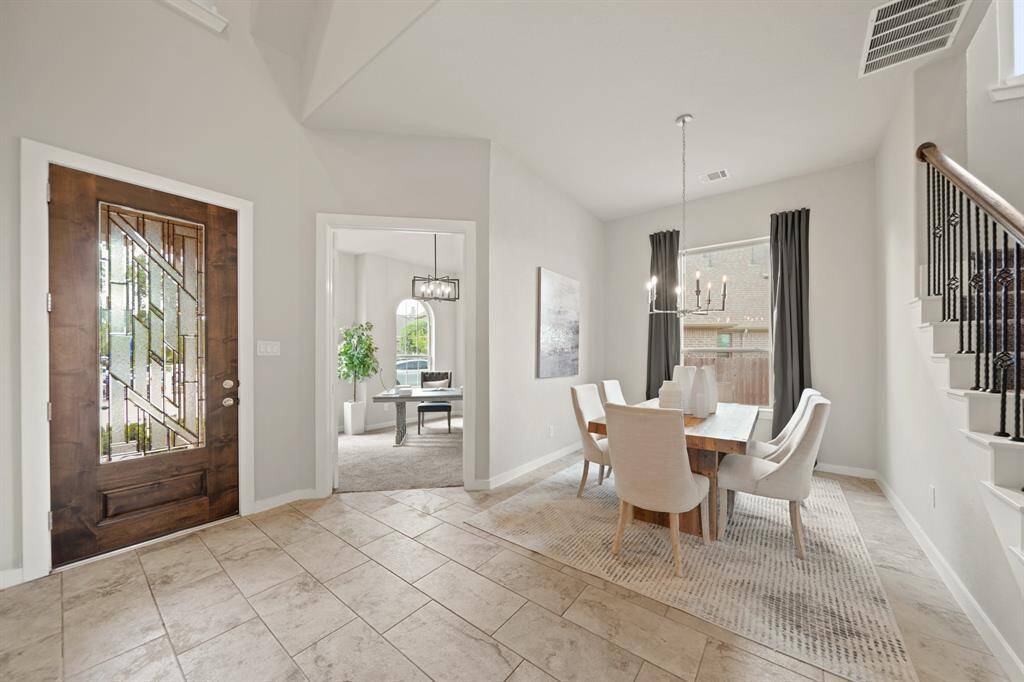 First Impressions That Last.This bright, beautifully captured view highlights the stunning floors, formal study, dining area, and the thoughtful flow of the entry. Clean lines, natural light, and timeless finishes welcome you into a space that instantly feels elevated.
