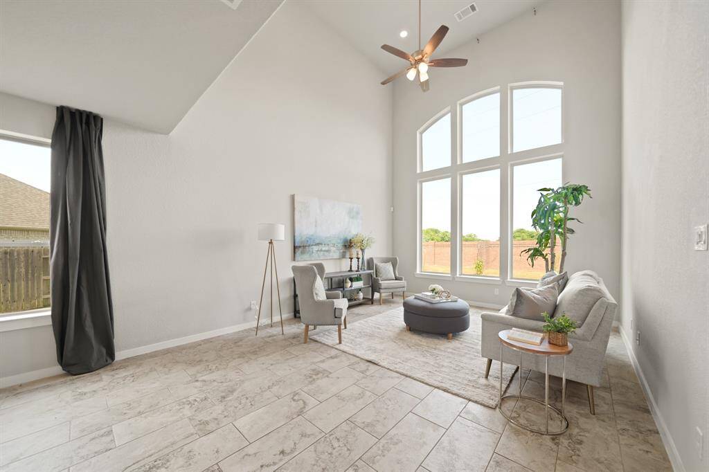 Convenience Meets Style.Located near the secondary bedroom downstairs, this bathroom is a rare and thoughtful feature. Move-in ready with a bright, clean aesthetic, it boasts a sleek countertop and modern finishes—perfect for guests or added comfort.