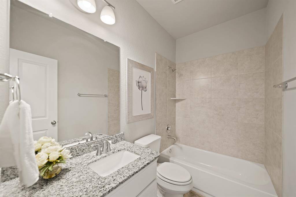 Comfort and Convenience in One.This spacious secondary bedroom is ideally positioned across from the stairs, offering easy access and privacy. With a view of the entry and a glimpse of the staircase, the room combines functionality with a serene atmosphere, making it perfect for guests or family.