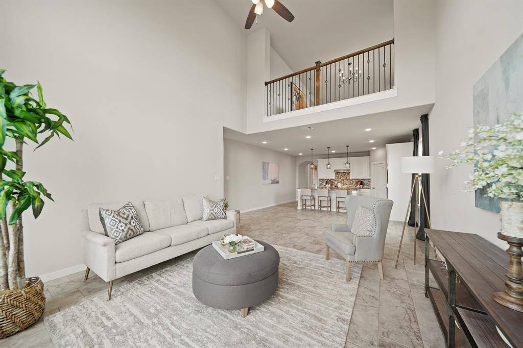 Spacious Living with a Sense of Openness.This massive living area, bathed in natural light, flows effortlessly toward the kitchen ahead. High ceilings and an open, airy atmosphere invite relaxation and connection, making this space ideal for both everyday living and entertaining.