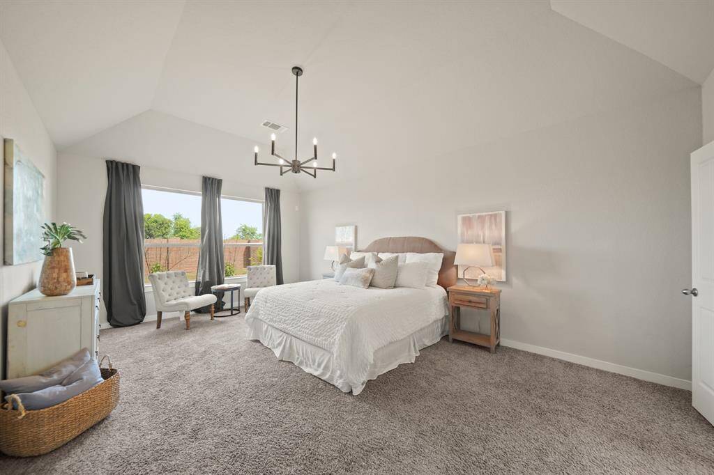Seamless Elegance and Comfort.From this angle, you’ll notice the beautiful French doors leading to the primary bath, enhancing the bedroom’s flow. With spaciousness, natural light, and direct access to the bath, this room is the perfect blend of luxury and functionality.