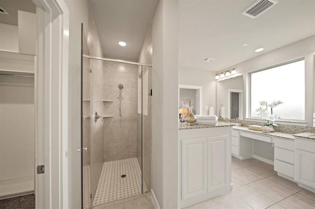 Organized Luxury.This walk-in closet features custom shelves and thoughtful organization, providing ample space for all your essentials. Designed for both style and function, it’s the perfect space to keep everything beautifully arranged and easily accessible.