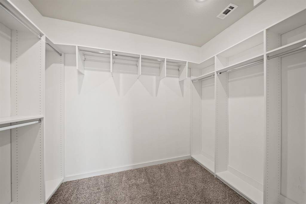 Versatile and Spacious.This upstairs room offers endless possibilities—whether for media, gaming, or as a cozy lounge area. With tall windows overlooking the downstairs, it invites natural light and provides a perfect space to relax or entertain.