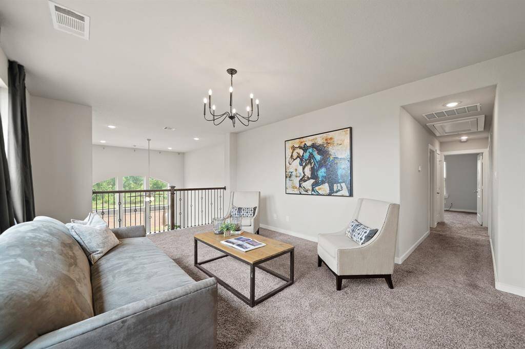 Endless Possibilities.This spacious upstairs media/game room is perfect for entertaining, relaxing, or unwinding. With ample space and natural light from the tall windows, it’s the ideal spot to create your own retreat.