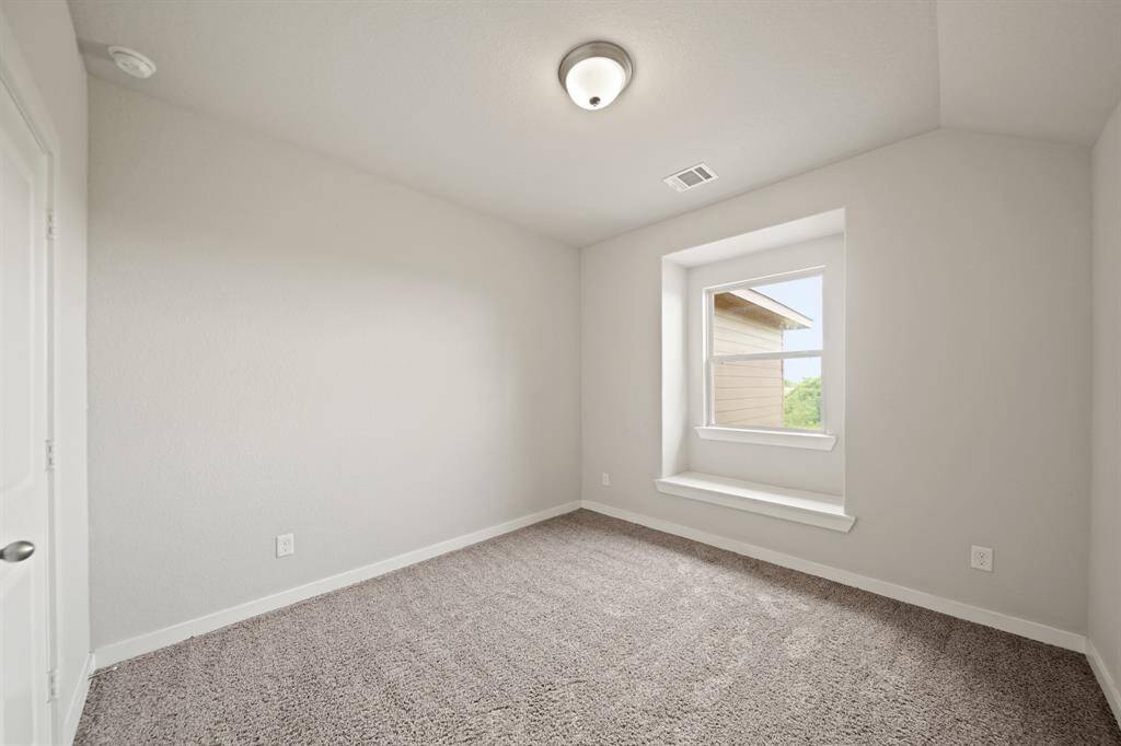 Versatile and Inviting.This spacious fourth bedroom offers endless possibilities—perfect for a guest room, hobby space, or personal sanctuary. With abundant natural light and a peaceful atmosphere, it’s a room that adapts to your lifestyle.