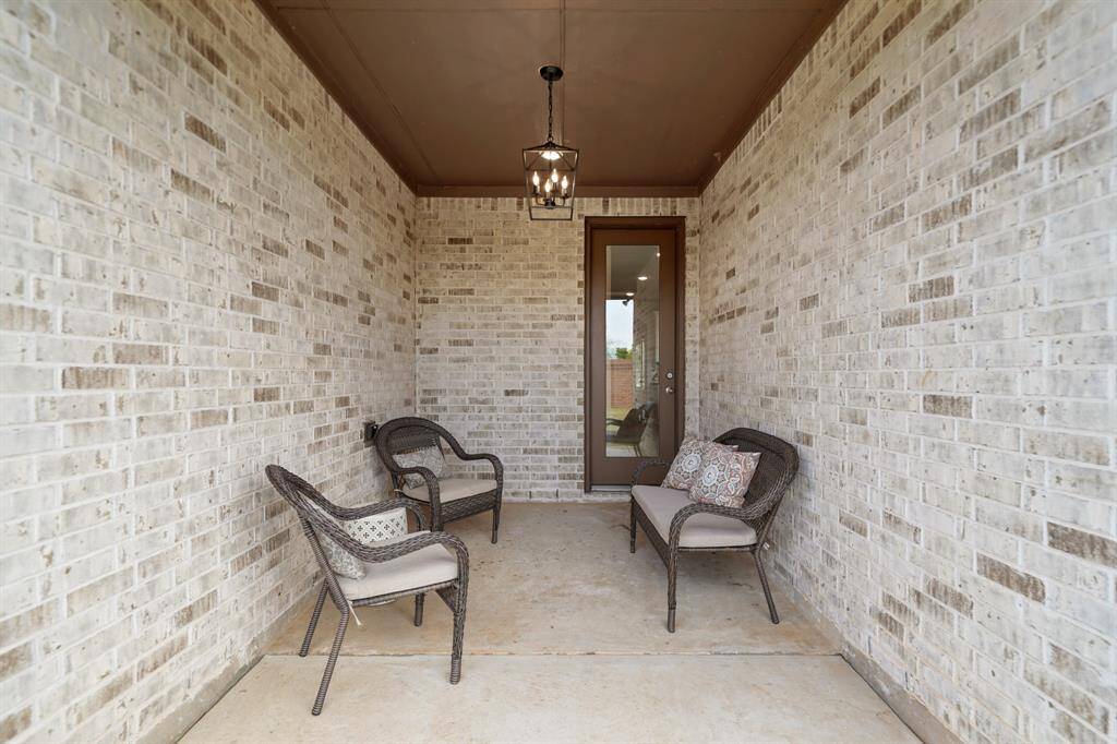 Expansive Backyard Oasis.This massive backyard offers endless possibilities, featuring a sturdy brick fence with no neighbors behind, ensuring privacy. Baby shrubs are planted, poised to grow and enhance the beauty of your outdoor retreat over time.