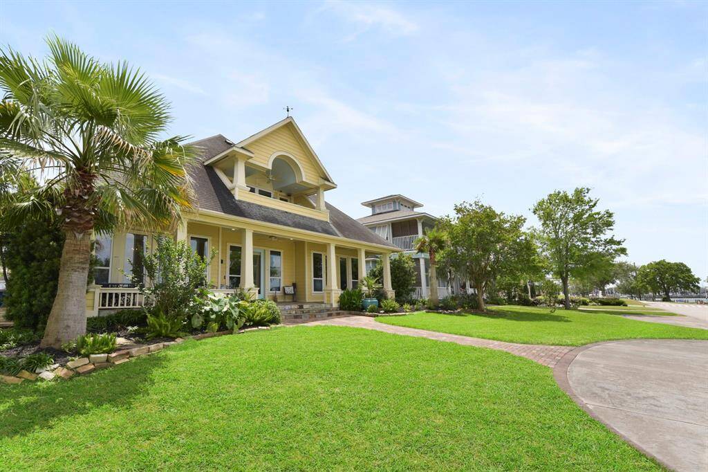 The entrance to the home has a beautiful stone walkway leading up to an expansive front porch.