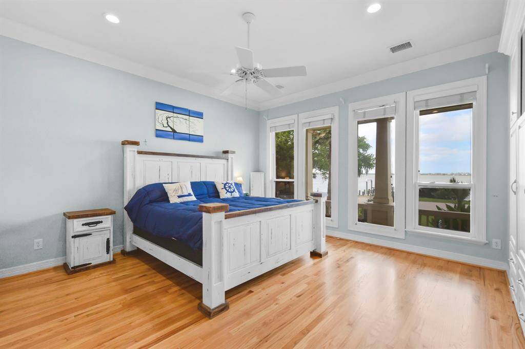 The Primary Bedroom overlooks the porch and beautiful Lakeview.
