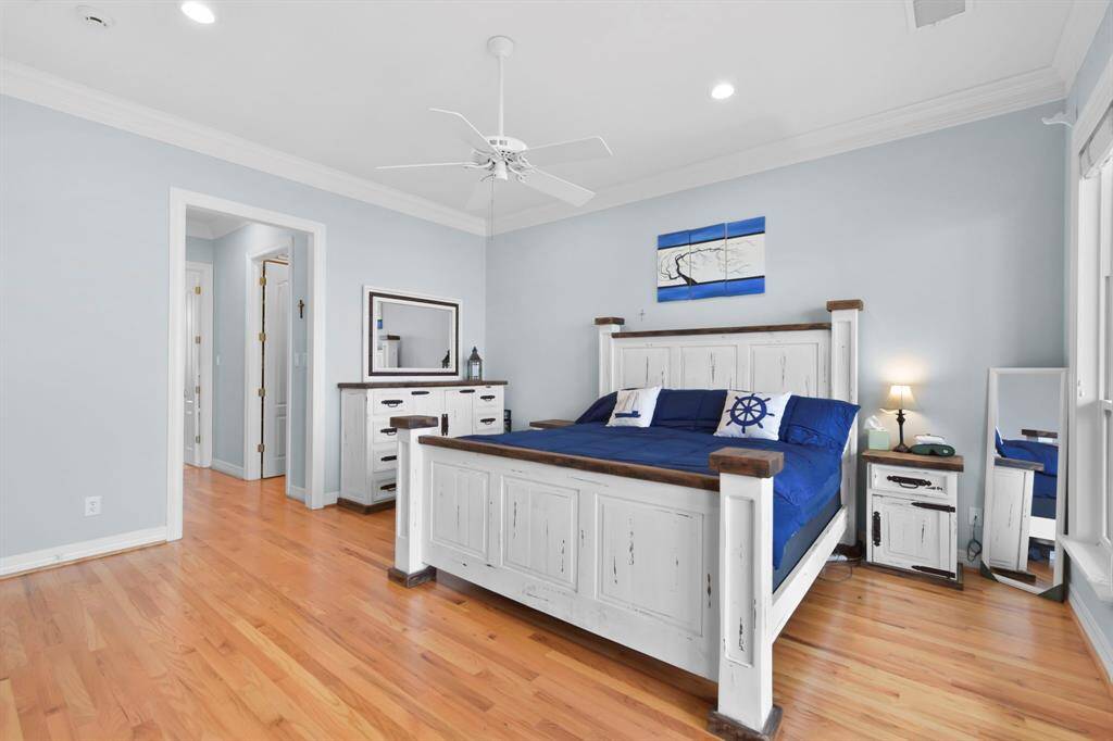 Opposite view of the primary shows the entrance to the Primary bath and Double closets.