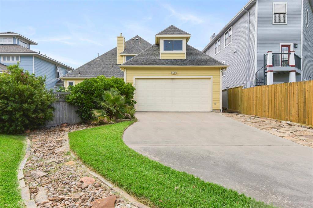 The entrance to the home is in the rear of the home with extra parking space.
