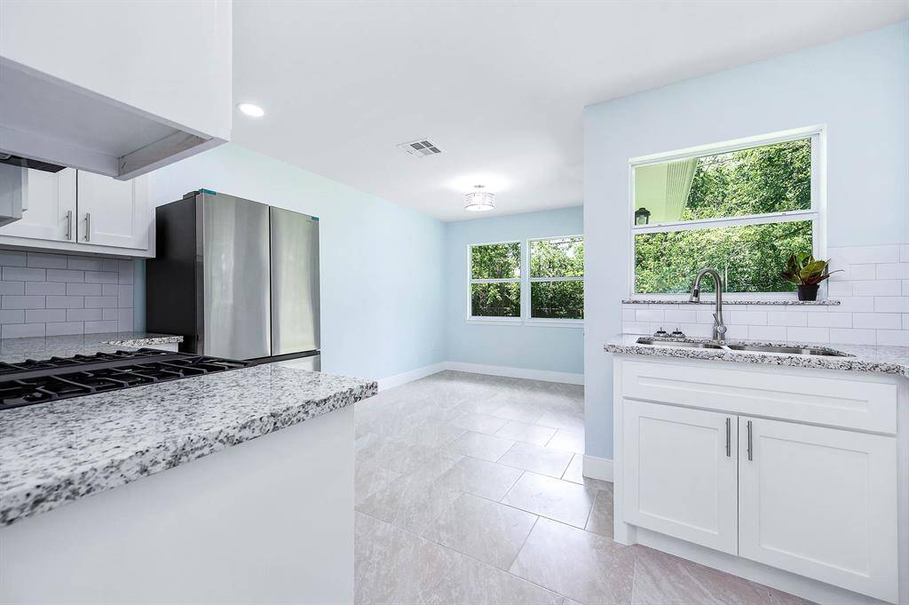 Brand new kitchen with granite coutertops and stainless appliances.