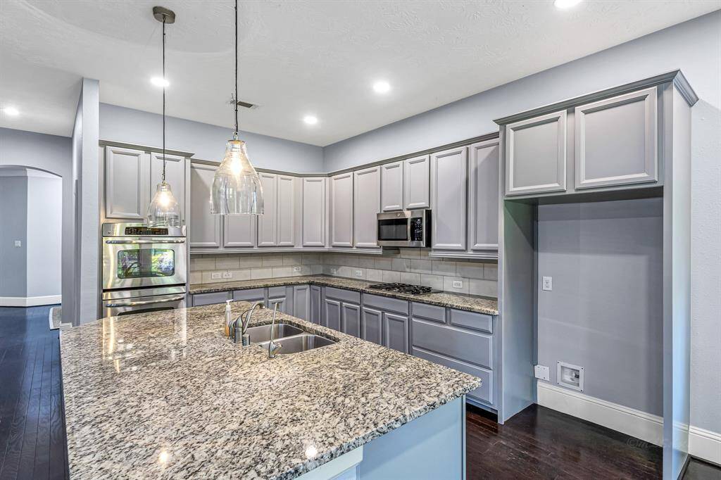 Plenty of room for cooking and gathering around this island. It truly is the heartbeat of this magnificent kitchen.