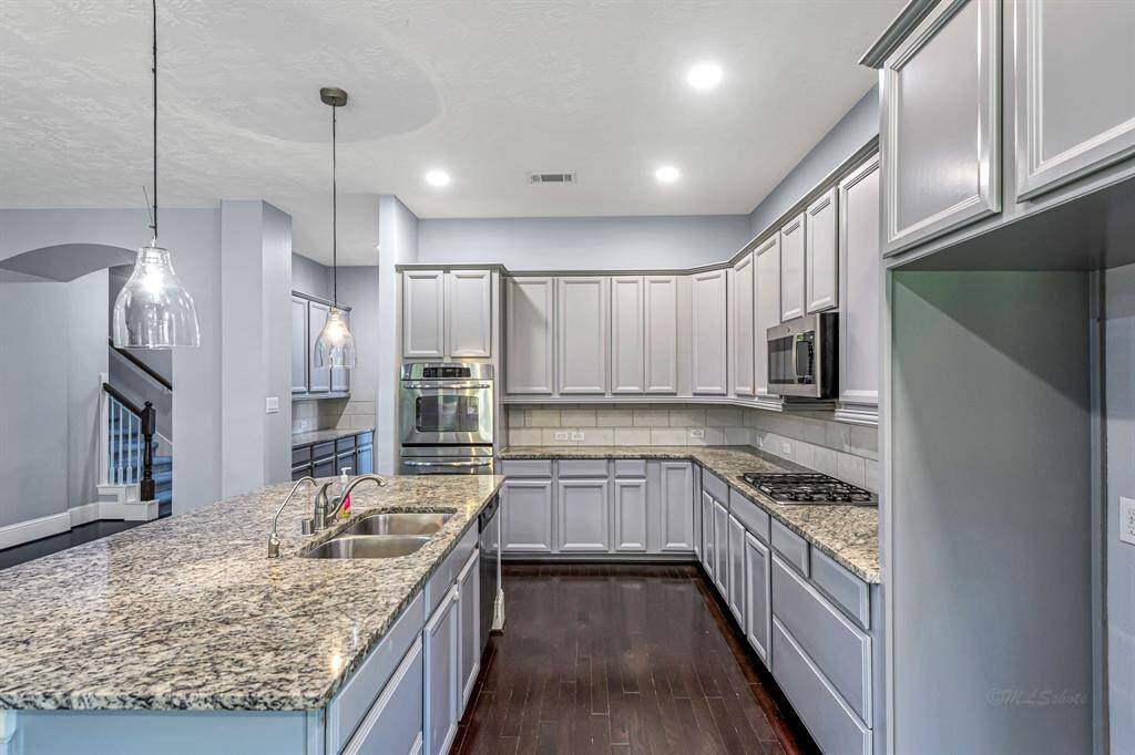 The gas cooktop is a top requested item on a buyer's wish list and double ovens make the holidays a breeze!