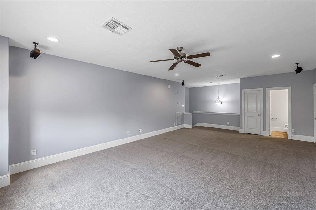 The upstairs bonus room also features a closet and powder bath.
