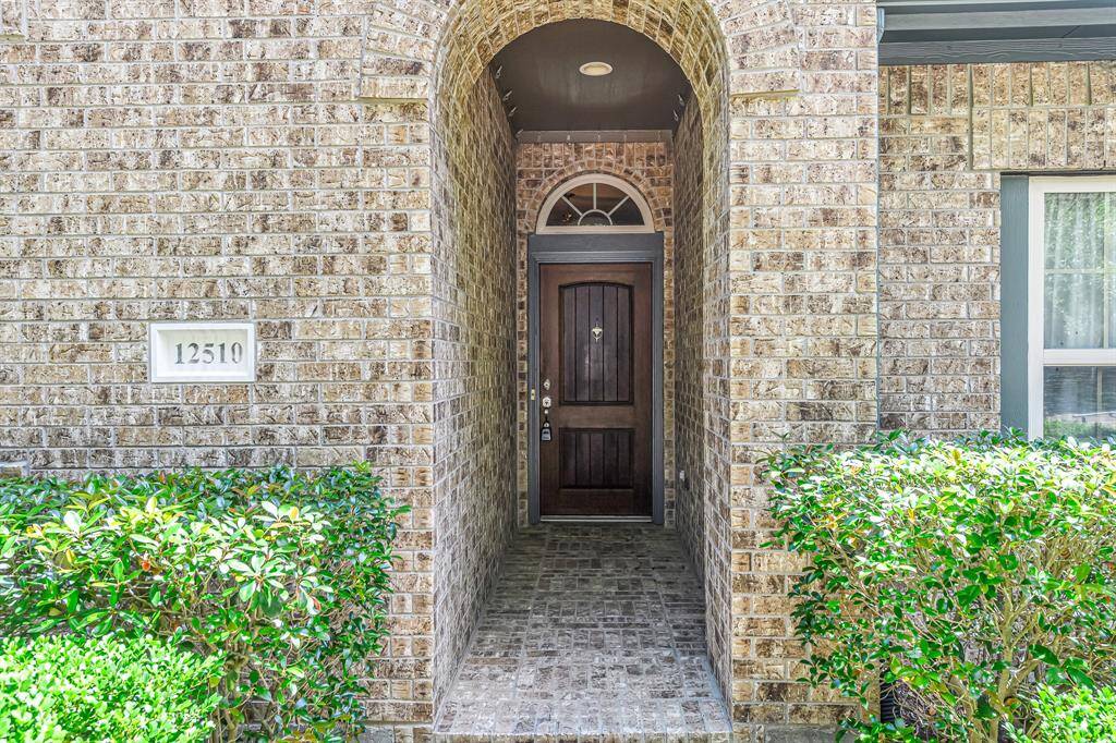 Arched brick entryway ushers you in.