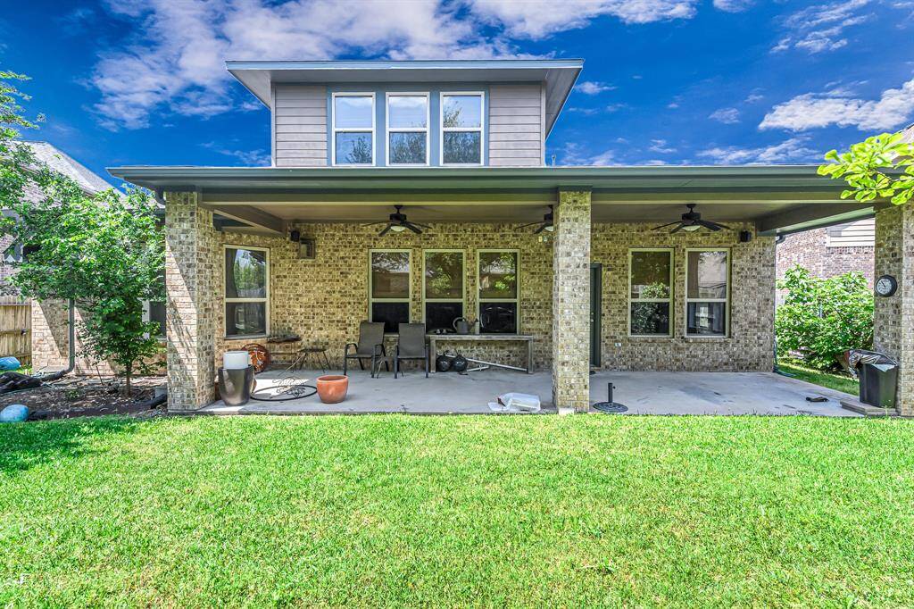 Brick columns accent the patio.