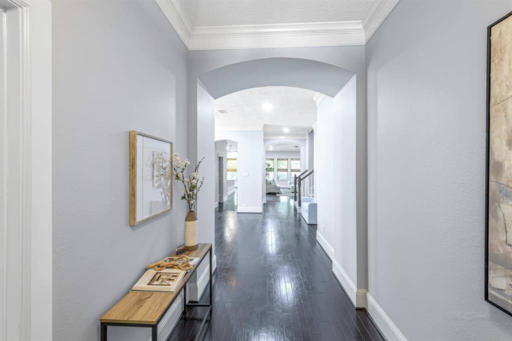 Stepping inside you are greeted with warm wood floors and soft, neutral color palette.