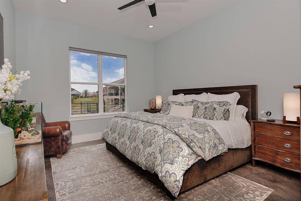 Spacious primary retreat also has views of the lake.