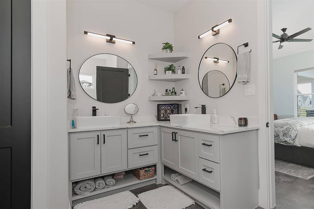 Dual sinks/vanities with updated fixtures and mirrors.