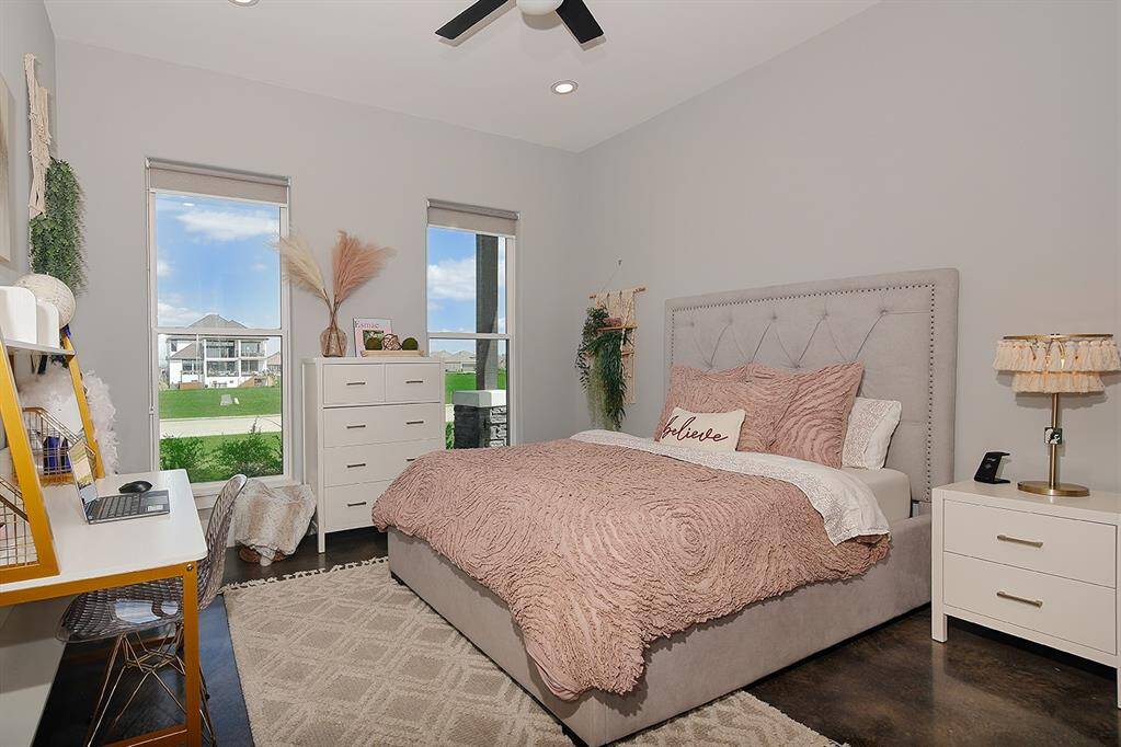 The secondary bedroom has peaceful front yard views.