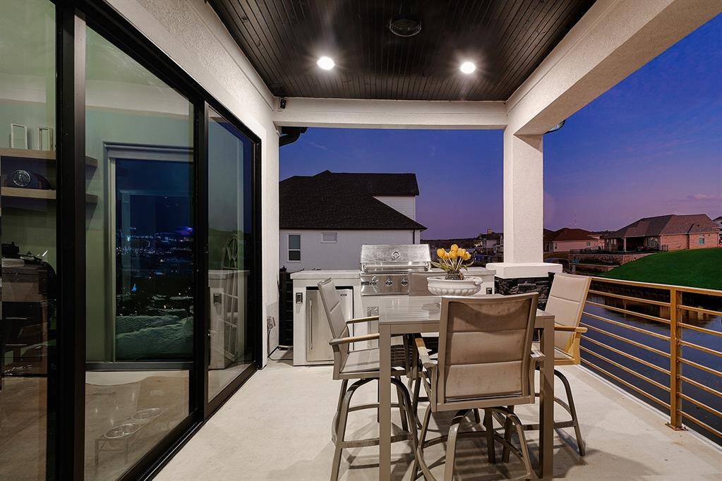 Entertaining is a breeze with the summer kitchen featuring grill and beverage refrigerator.