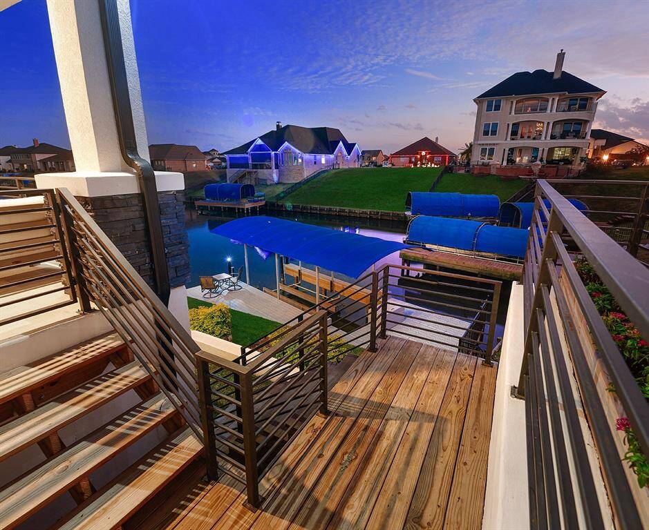 Stairway with custom railing and retaining wall leads you to the boat dock.