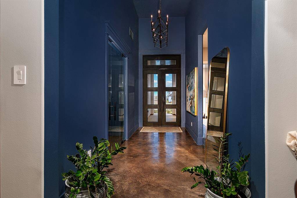 Wine storage located behind the seamless glass door creates an elegant feel as you enter.