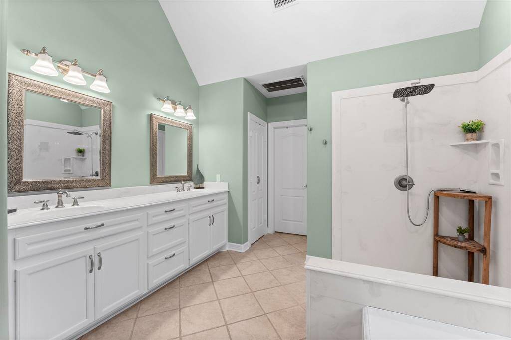 Primary bathroom with large walk in closet.