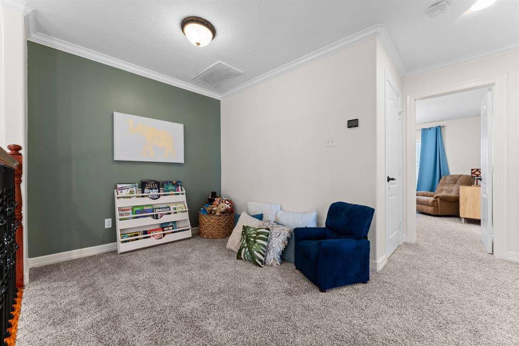 Landing area right at the top of the stairs that is a perfect sitting or studying space for the kids!