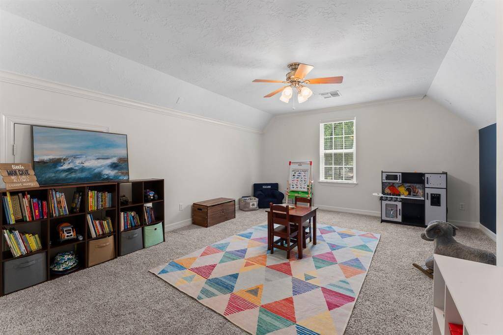 This is a large flex space/game room with hidden closet and access to the bathroom!