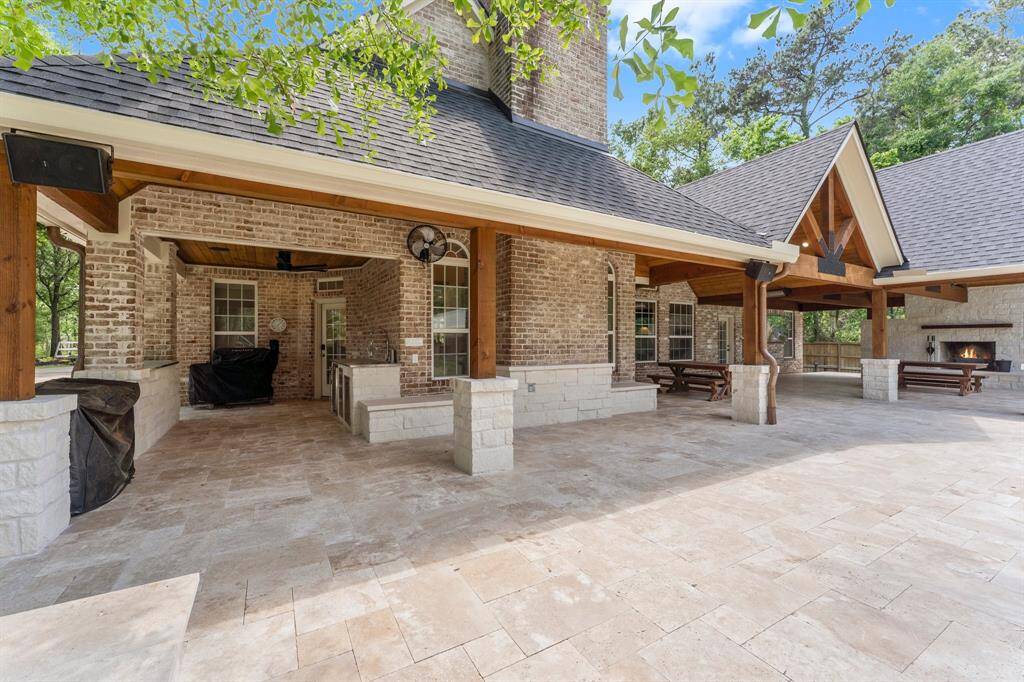 Just wow! Outdoor kitchen with sink and refrigerator.