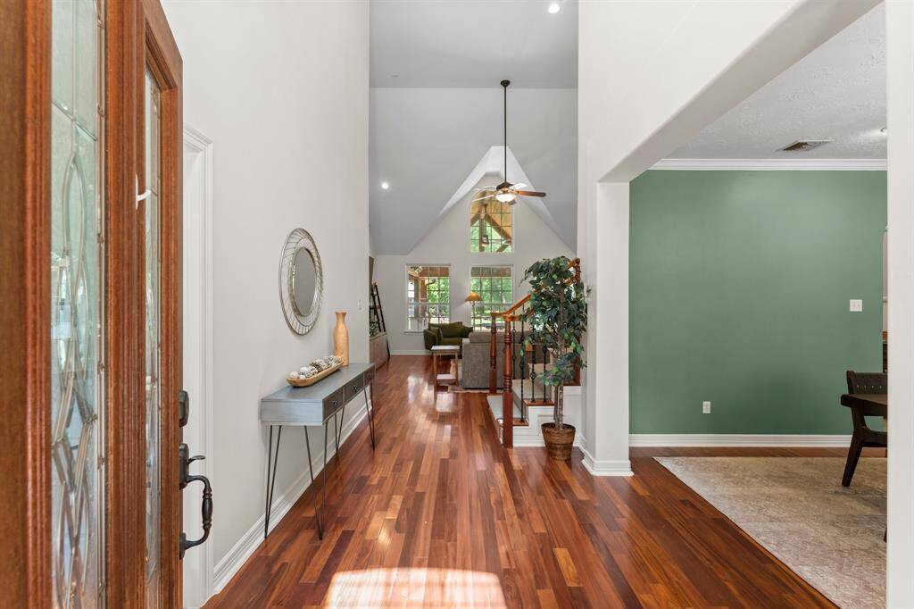 What a beautiful entrance! The bella wood floor are gorgeous! Office directly to the left and fine dining to the right.