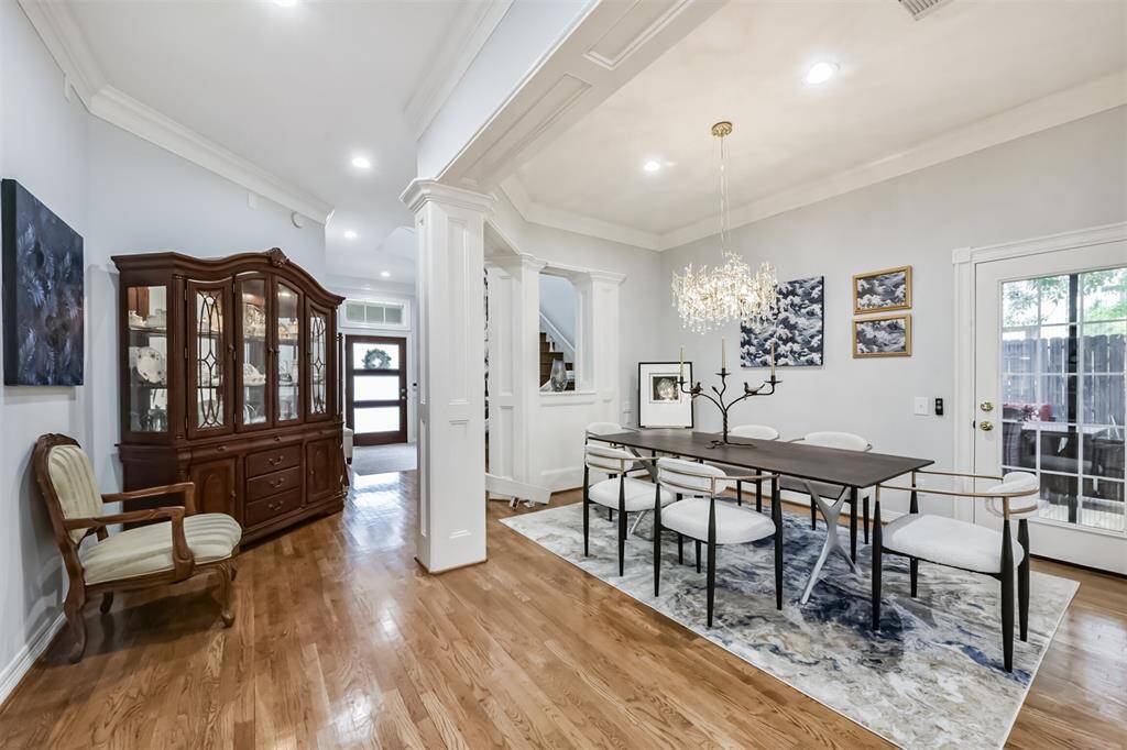 Looking toward front door from living area ! notice the stunning modern chandelier.