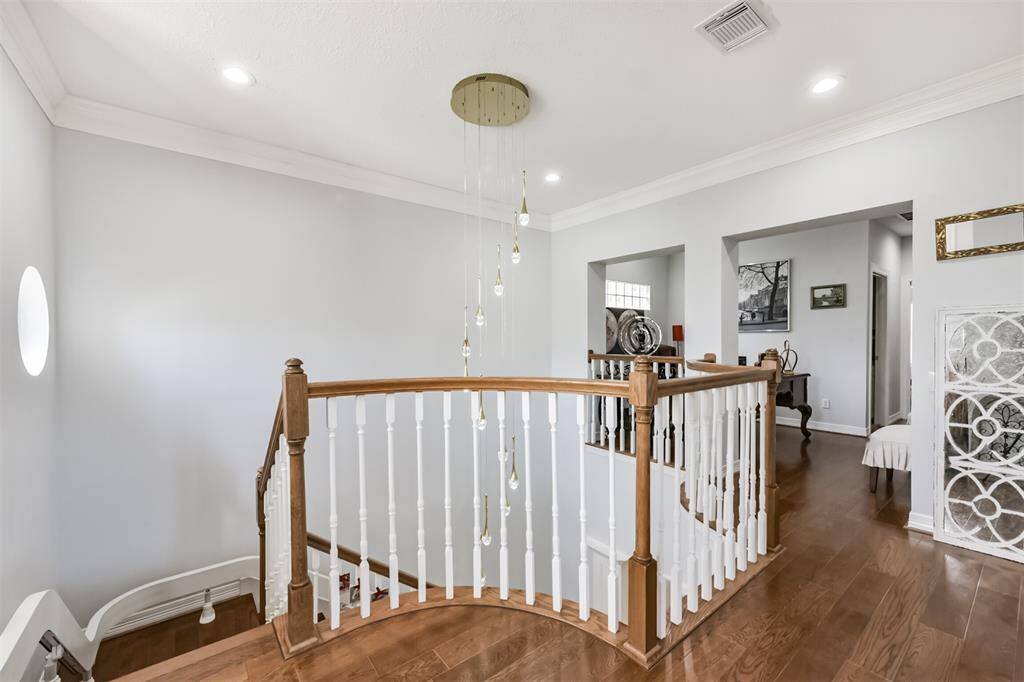 Lovely  modern lighting at top of stairs. Acorn stairlift offering a safe and convenient way to access upper level for those needing extra support.