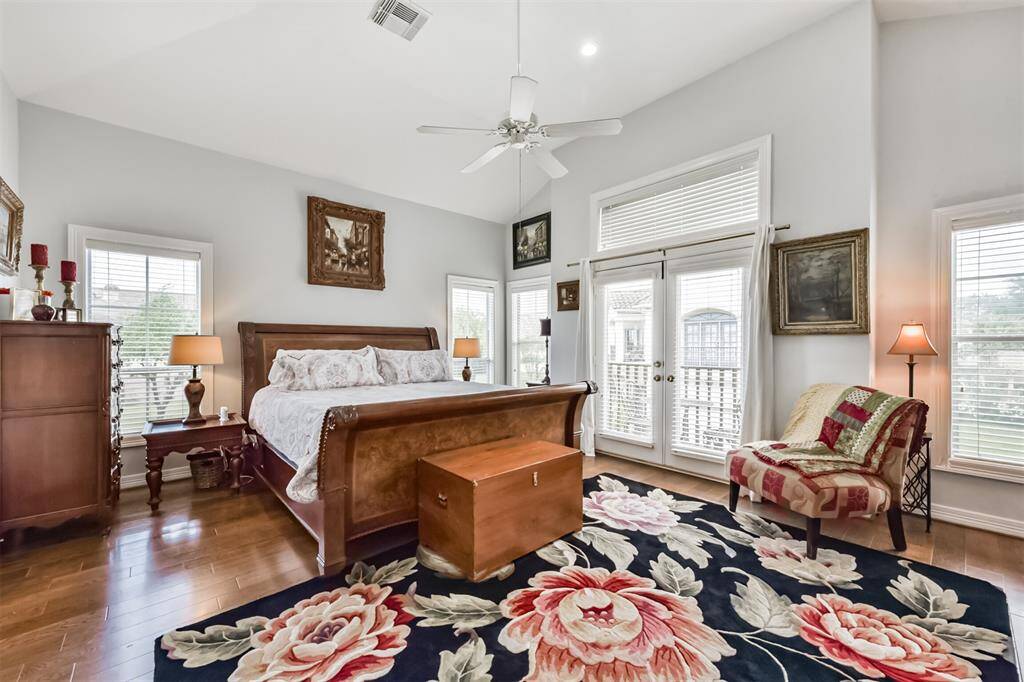 Spacious primary bedroom easily accommodates a king-size bed and offers direct access to a private balcony- perfect for morning coffee or relaxing in the evening.