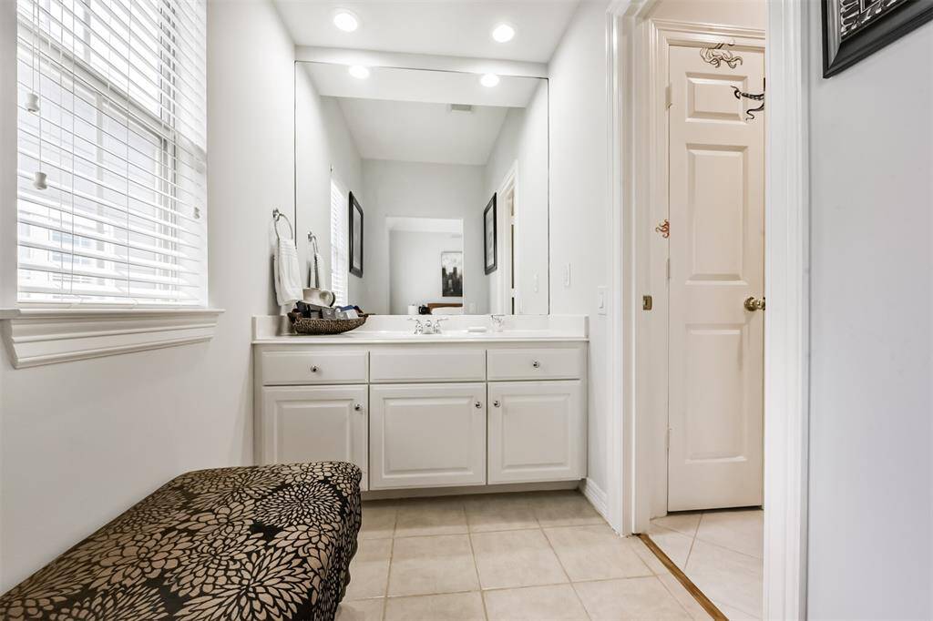Enjoy the privacy of your own sink vanity area in the shared Jack n Jill bathroom. Offering both personal space and convenience.