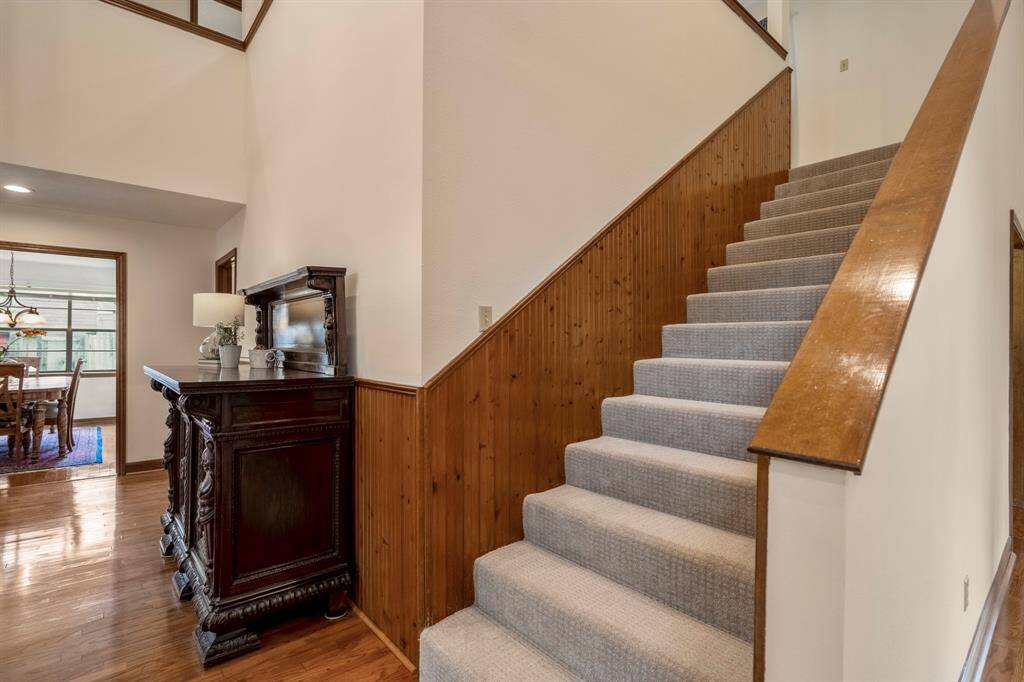 Carpeted staircase off the Foyer with brand new carpet installed.