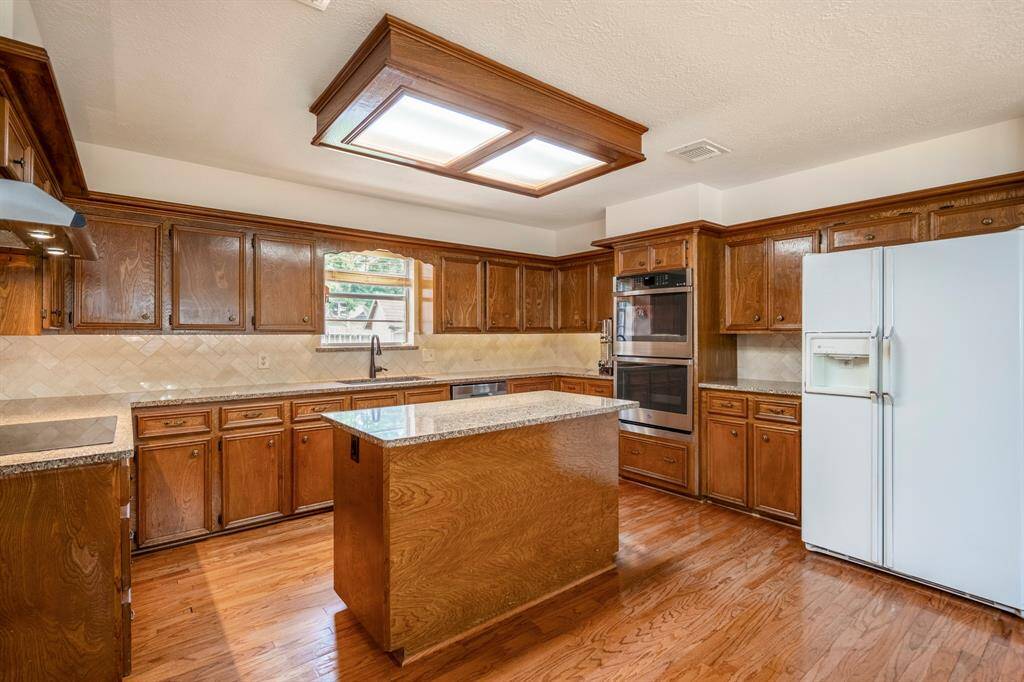 This Kitchen has plenty of counterspace and cabinetry