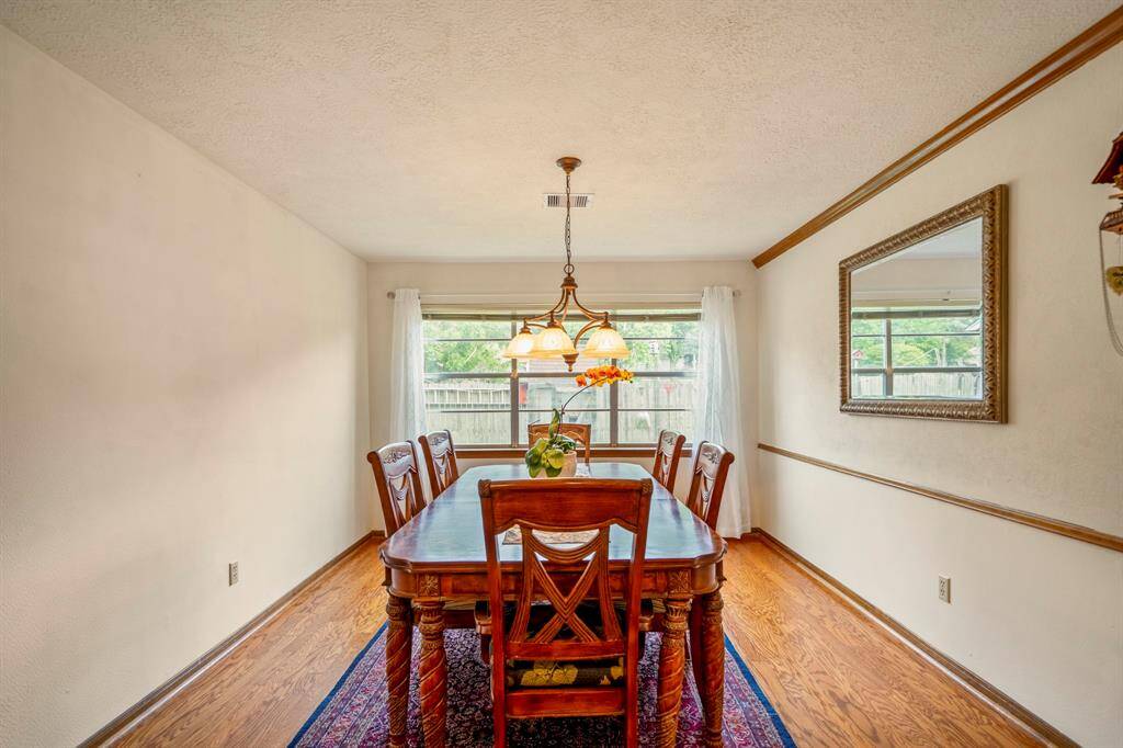 Formal Dining Room with large window overlooking back yard.